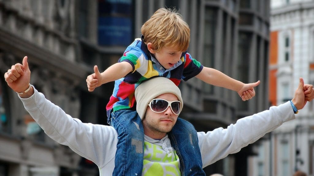 Father carrying his son on his shoulders