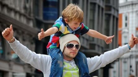 Father carrying his son on his shoulders