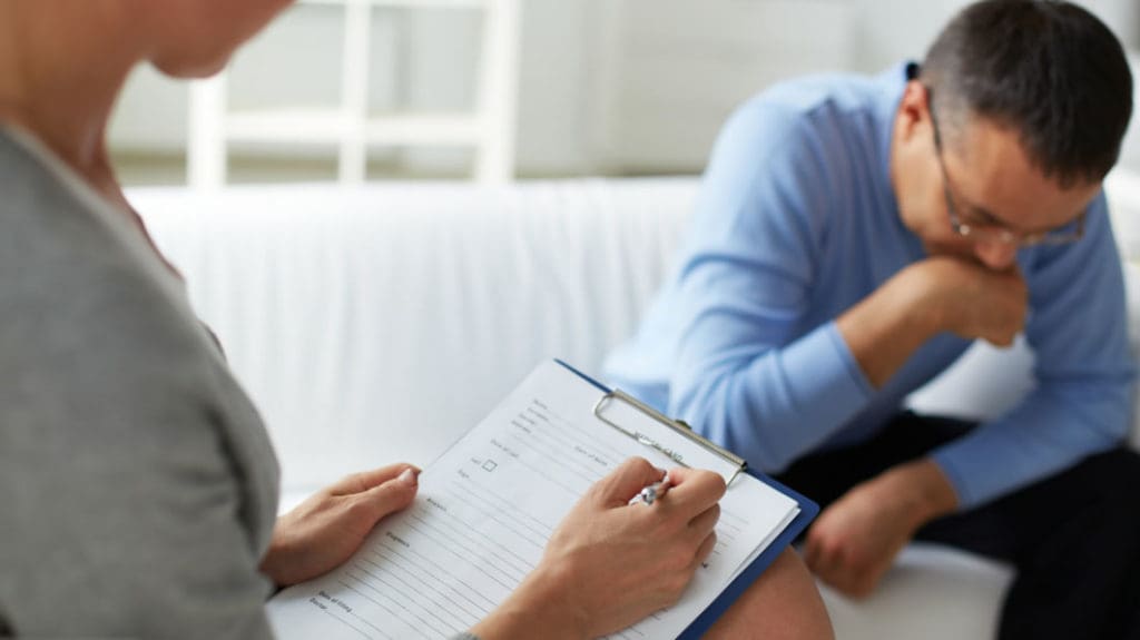 Man sitting in a counseling session