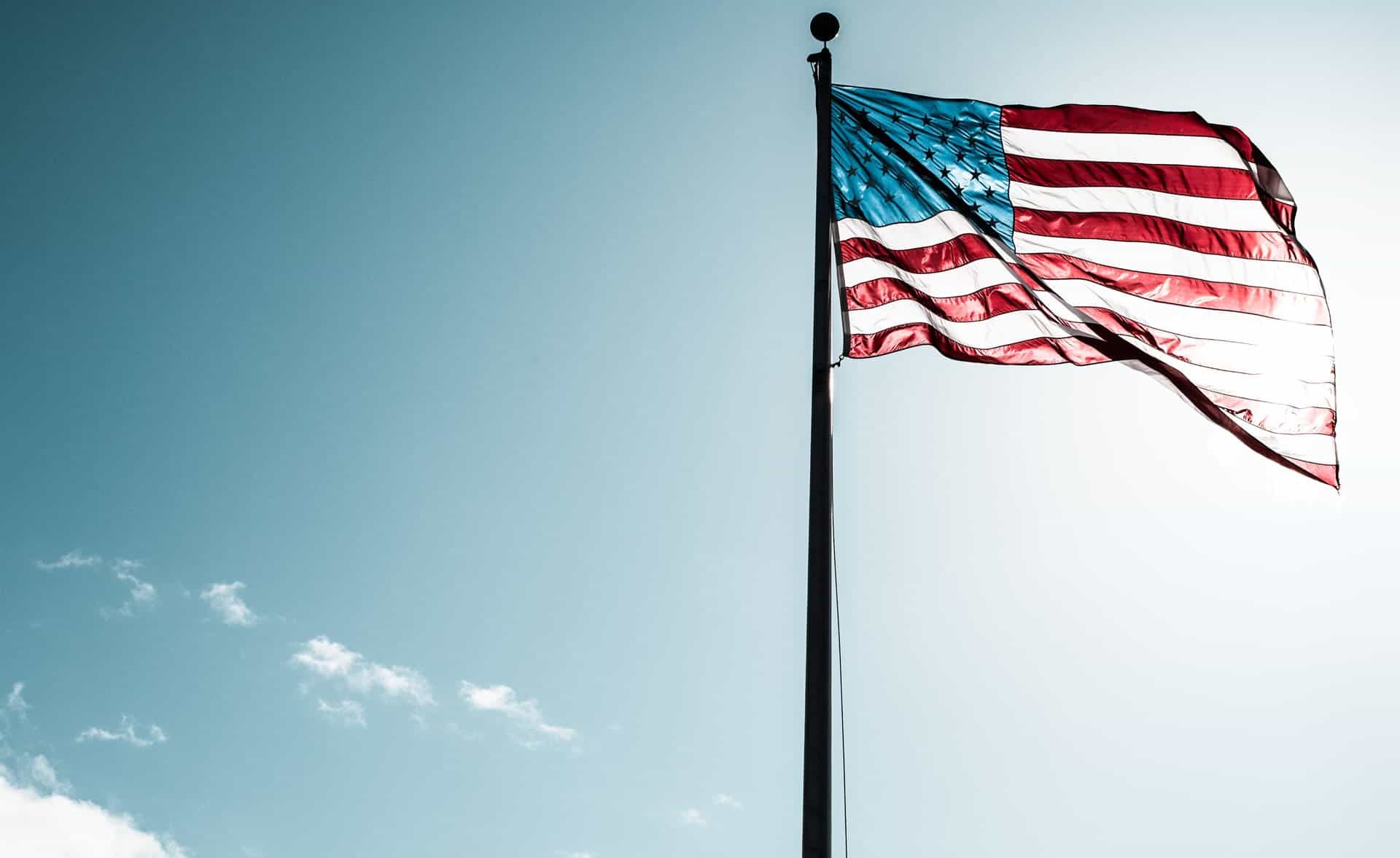 Man dropping election ballot into a ballot box