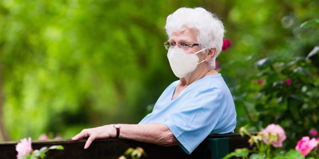 Elderly woman wearing a medical mask