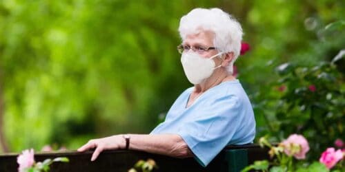 Elderly woman wearing a medical mask