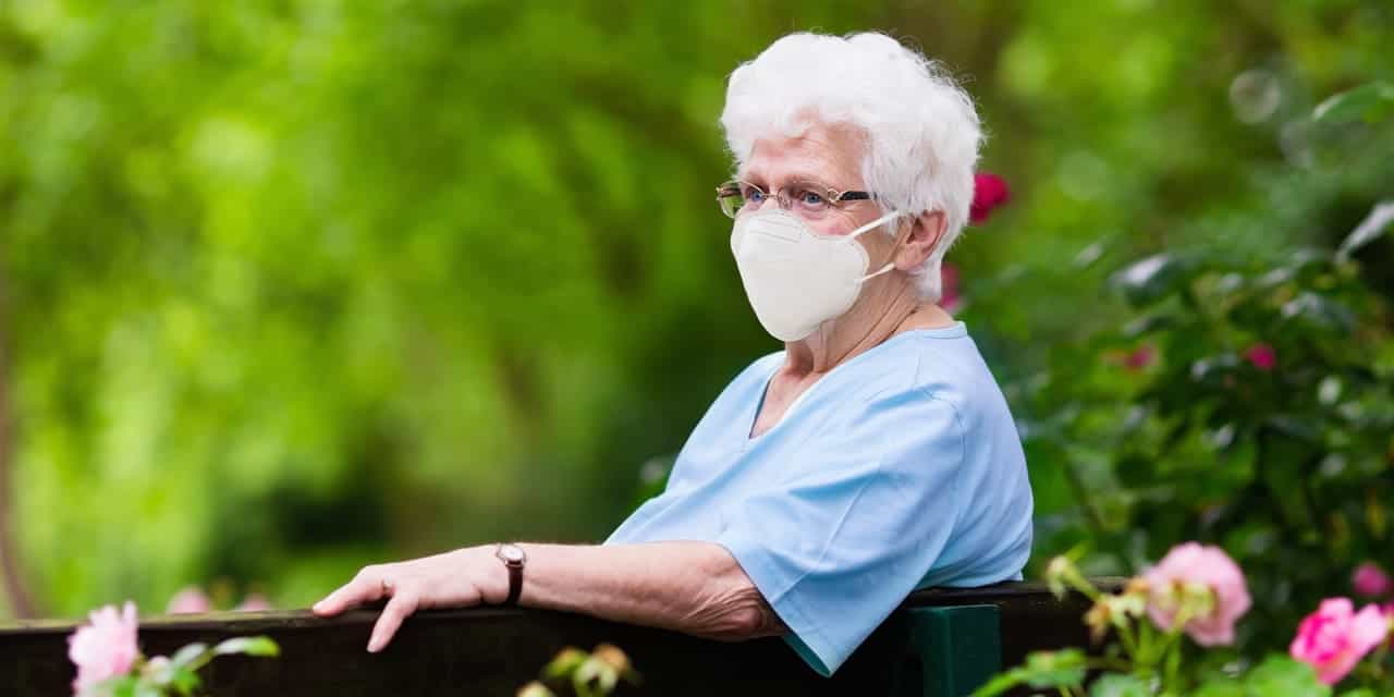 Elderly woman wearing a medical mask