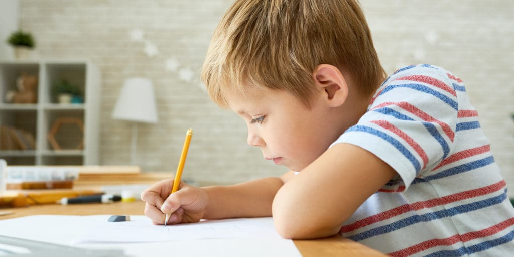 Young boy doing homework