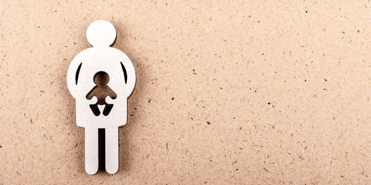 Wooden cut out of a pregnant woman