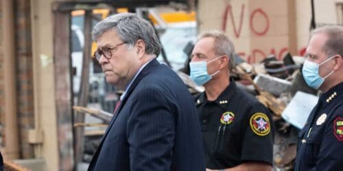 Attorney General William Barr stands by President Trump as he speaks to Kenosha County Sheriff David Beth and Kenosha Police