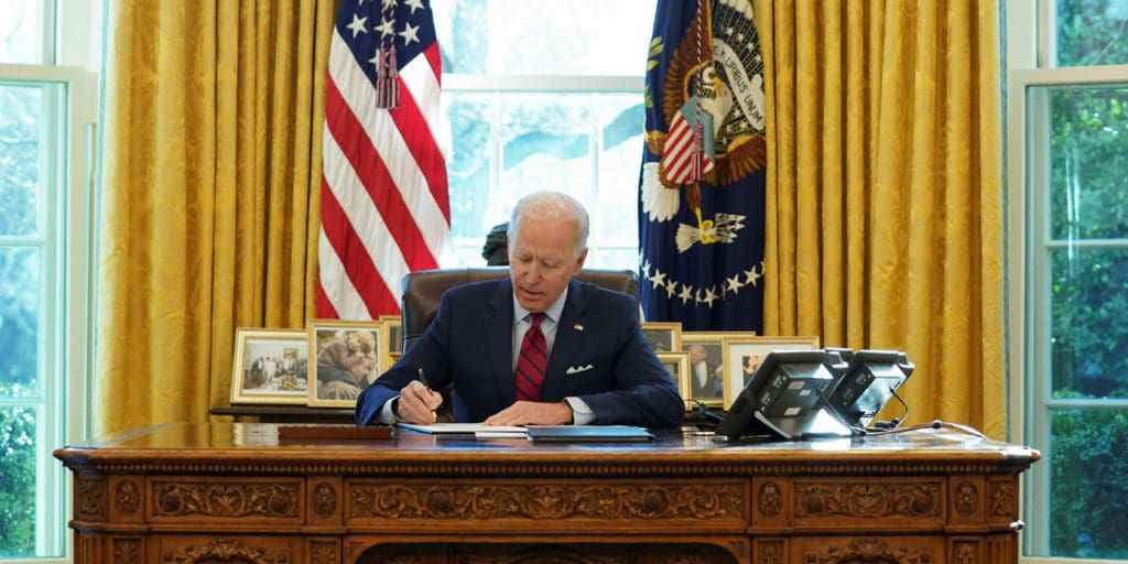 President Joe Biden signs an executive order