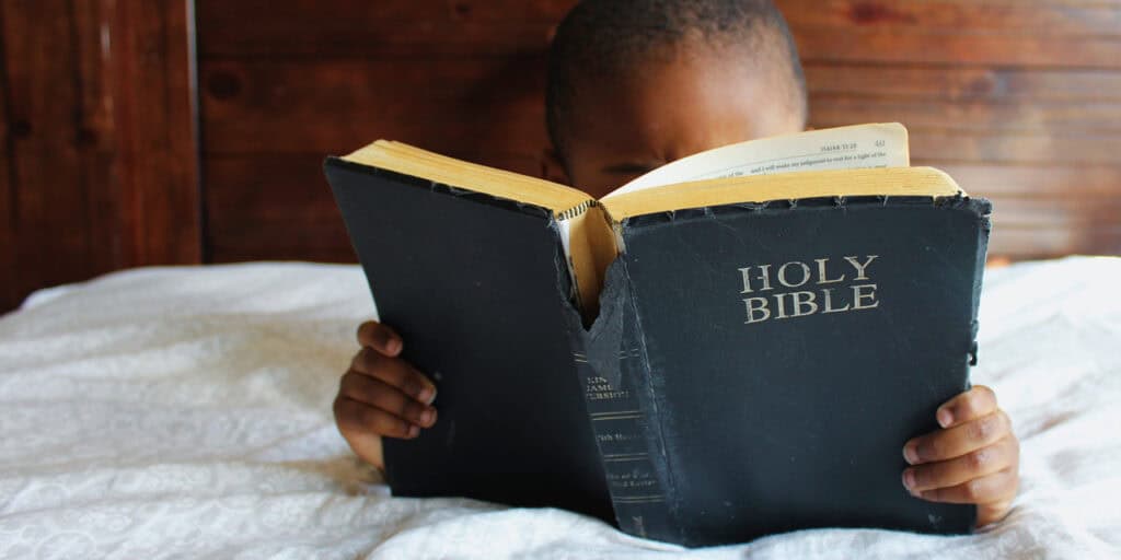 Boy reading Bible