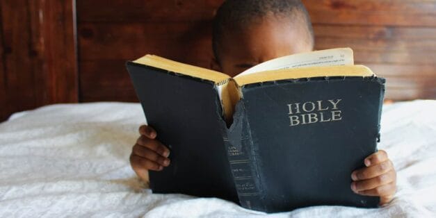 Boy reading Bible