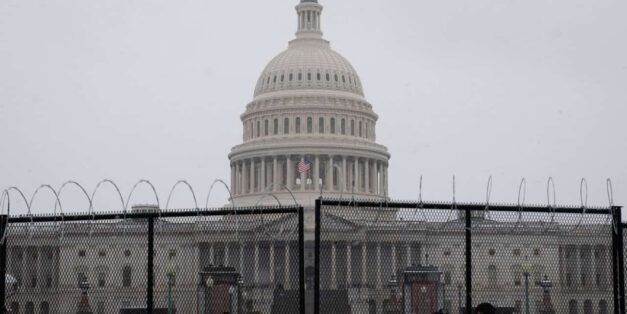 U.S. Capitol surrounded by barbed wire fences