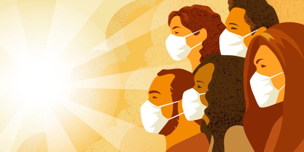 People in masks facing the sun