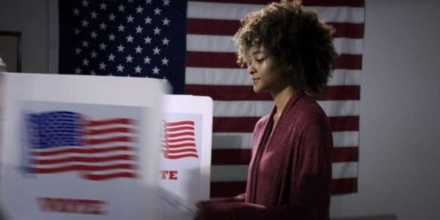 Woman voting at a booth